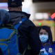 The Transportation Security Administration (TSA) is preparing to possibly begin to take passengers’ temperatures at airports in the U.S. Above, a passenger goes through a TSA screening in Pittsburgh.